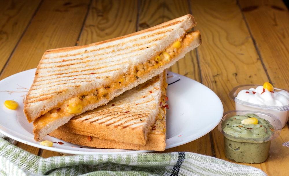 bread with cheese fillings on white ceramic plate