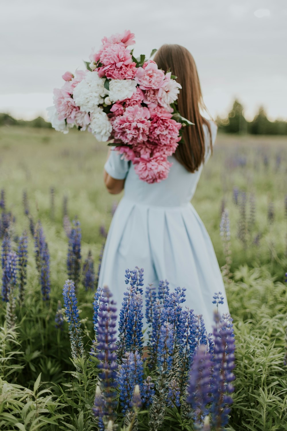 woman carrying flowers