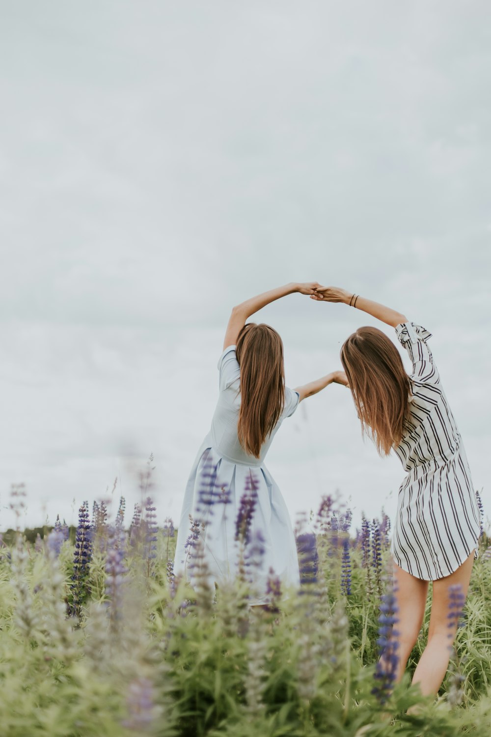 two women holding theier hands