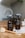 two brown spray bottles on brown table