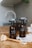 two brown spray bottles on brown table