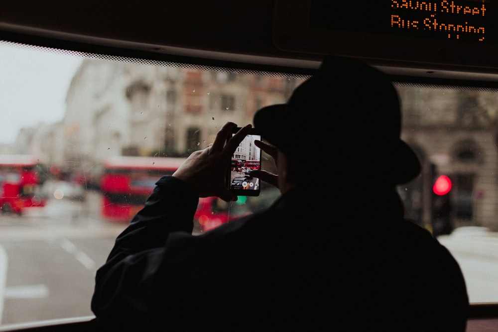 photo of man taking photo outside the vehicle