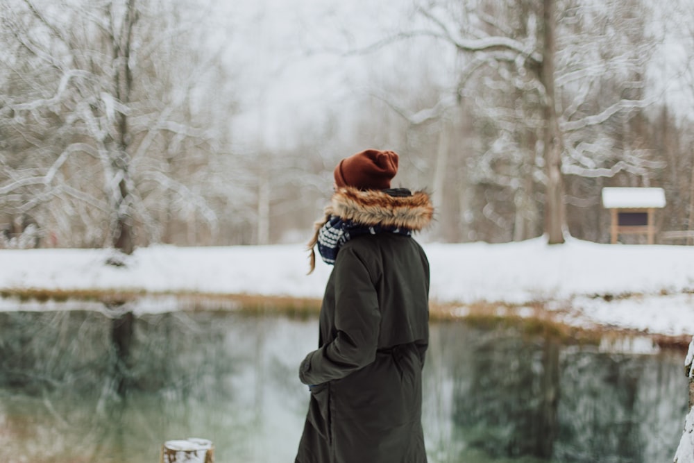 person standing near body of water