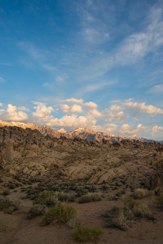 brown mountain under blue sky and white clouds during daytime in Alabama Hills United States