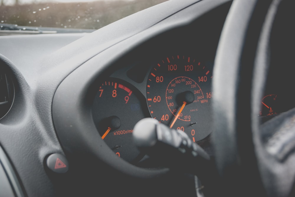 closeup photography of vehicle cluster panel