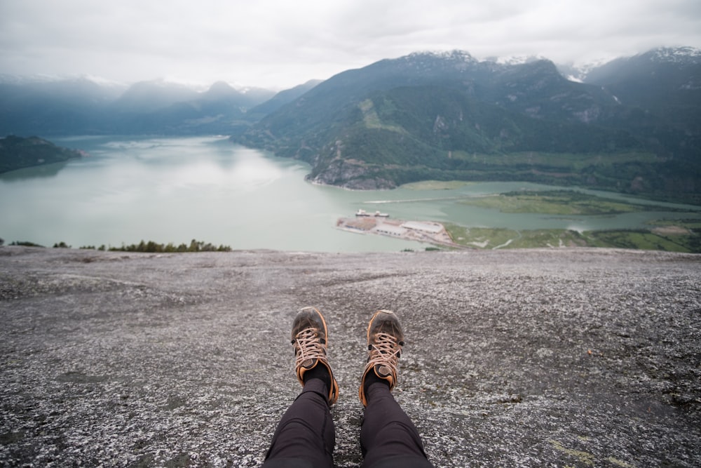 person sitting on rock