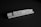 Wooden tiles spelling the word 'lawyer' are arranged on a wooden tile rack. The image is in black and white, set against a dark background.