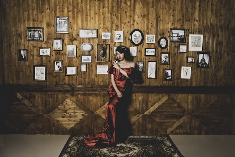 woman posing while leaning on wall