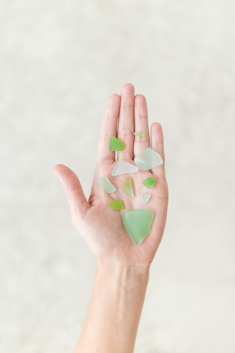 person holding green shards
