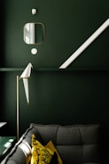 square framed mirror over gray sofa