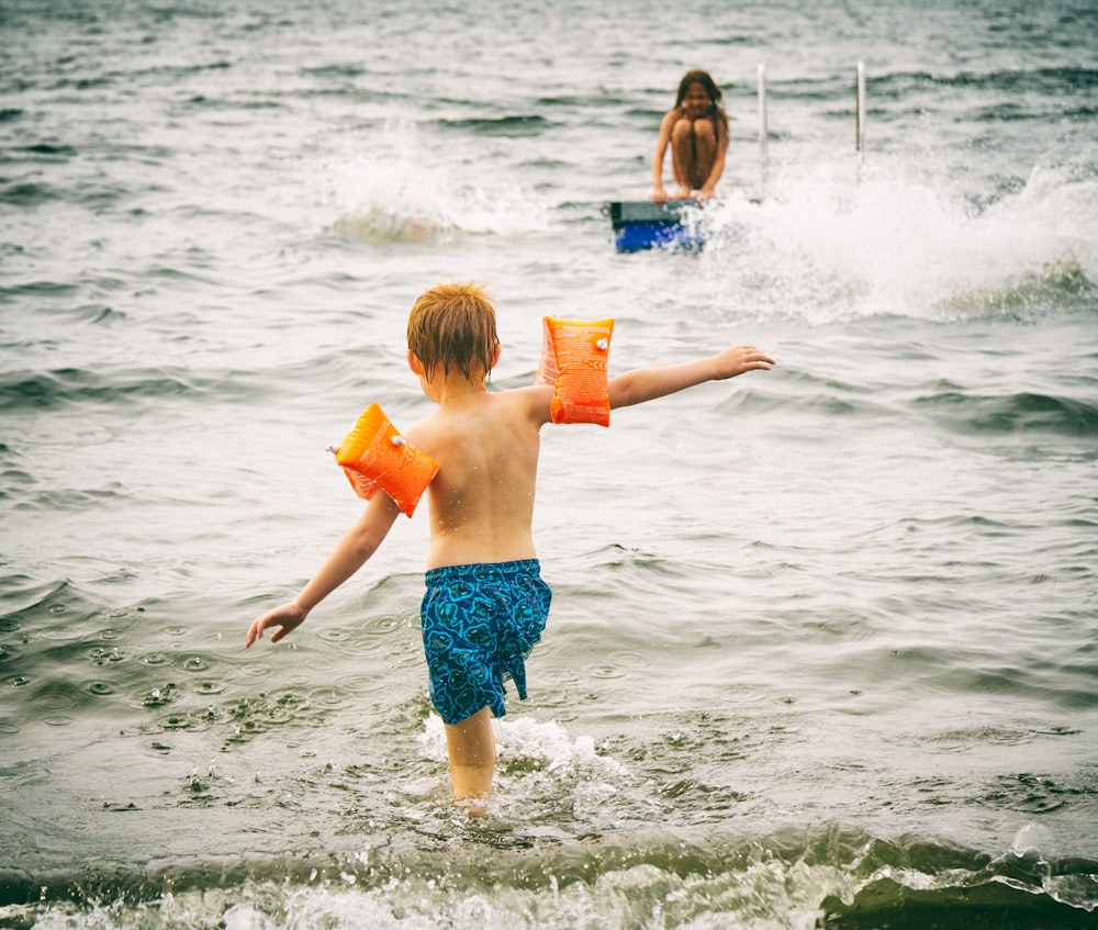 boy going through body of water