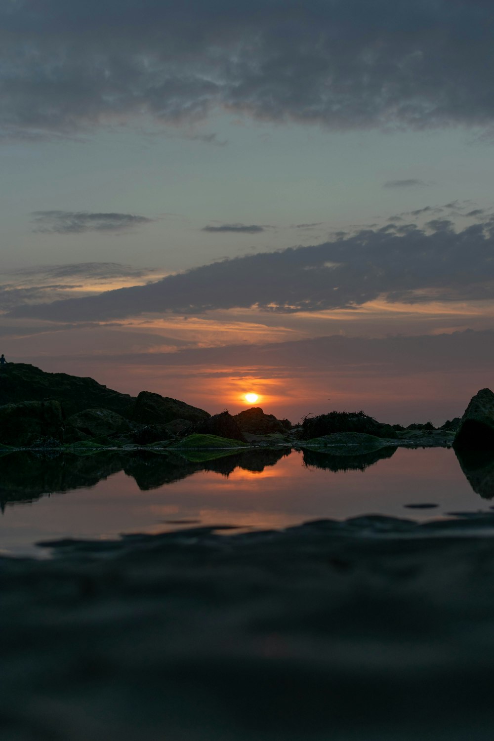 body of water near rock formation