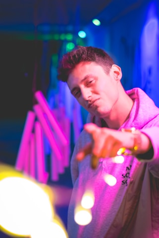 A dynamic vertical video-style image of a confident influencer in neon-lit urban setting, embodying future-forward digital culture.