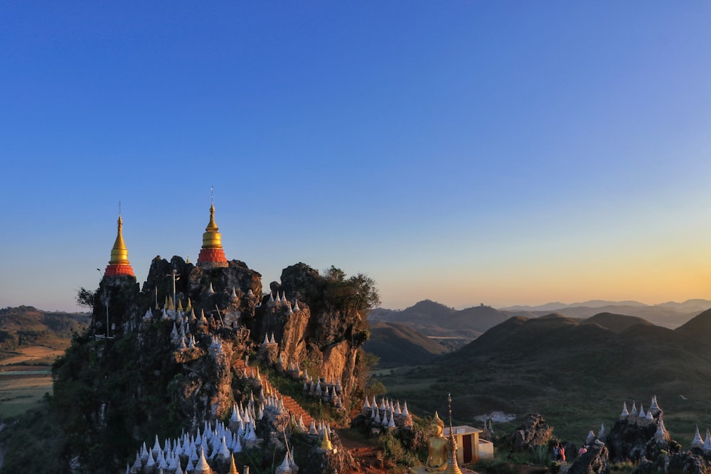 two red temples on mountain peak