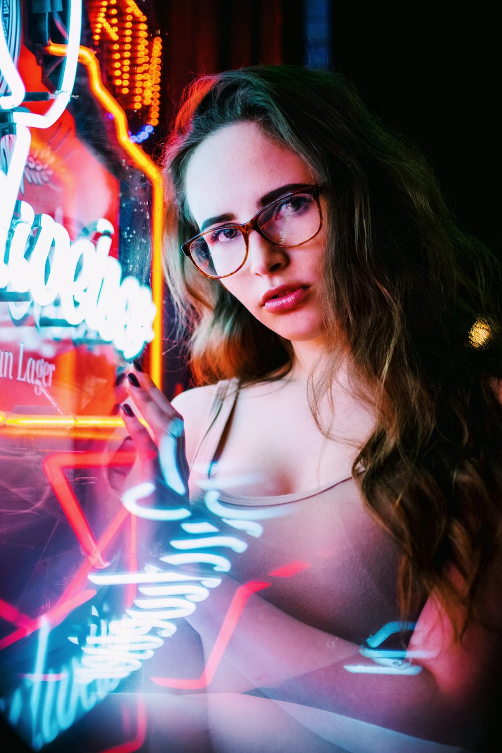 woman standing near neon light signage