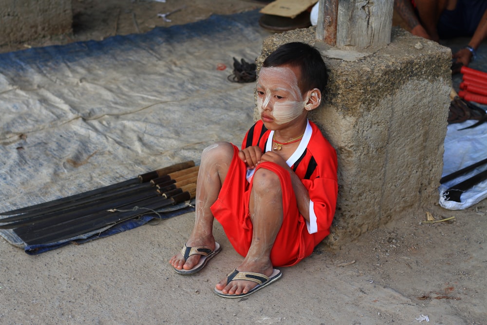 boy sitting on floor