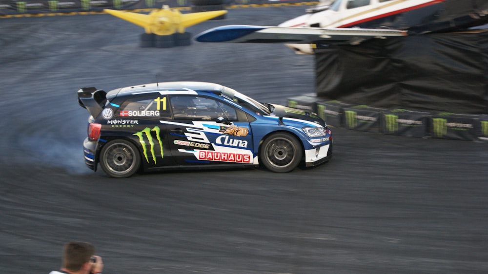 car on racetrack near tarp