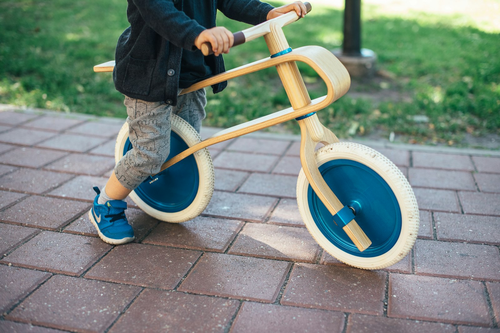 Nikon AF-S Nikkor 50mm F1.4G sample photo. Toddler riding balance bike photography