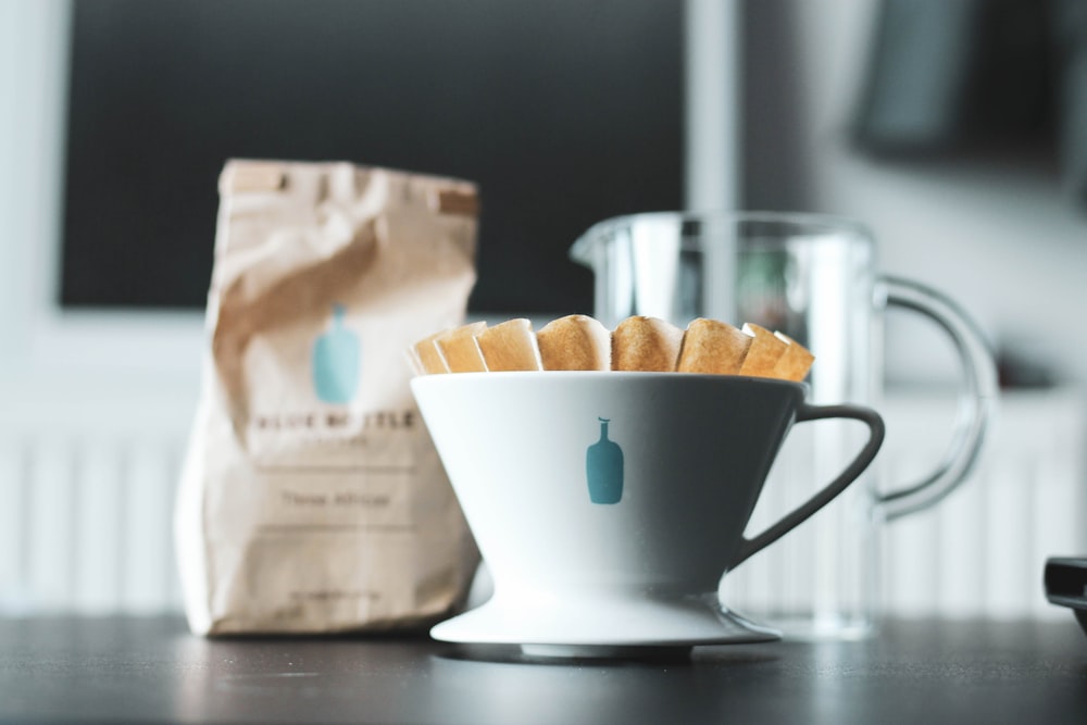 white ceramic mug on table