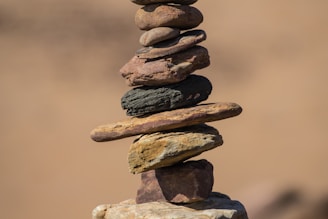 selective focus photography of balance stones