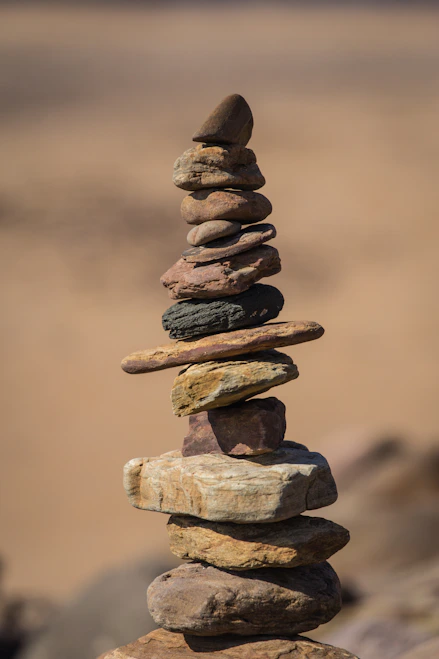 selective focus photography of balance stones
