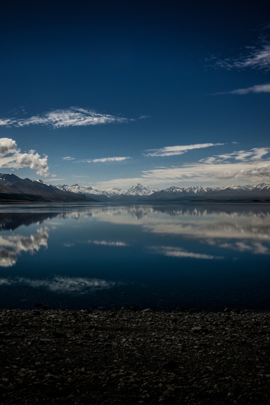 reflection photography of tall mount on body of water in Lake Pukaki New Zealand
