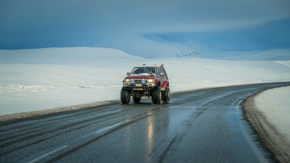 red car on road