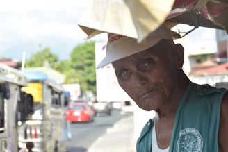 A local journalist interviewing a community elder in a coastal village of Manus.