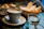 A cozy café scene with a cup of special coffee and a focaccia on a wooden table.