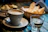 A cozy café scene with a cup of special coffee and a focaccia on a wooden table.