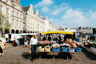 A vibrant market scene in a Czech town with colorful stalls.