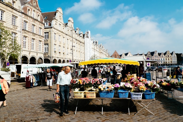A vibrant market scene in a Czech town with colorful stalls.