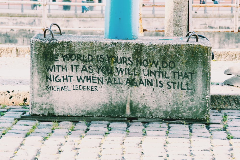 gray concrete with quotes on pavement