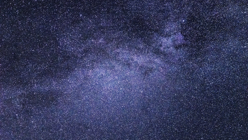 black and purple milky way at night time
