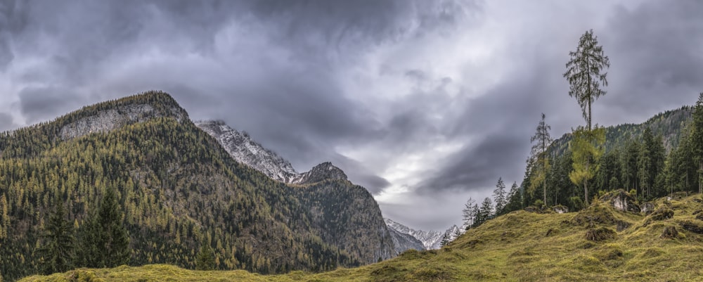 green mountain under gray clouds at daytime