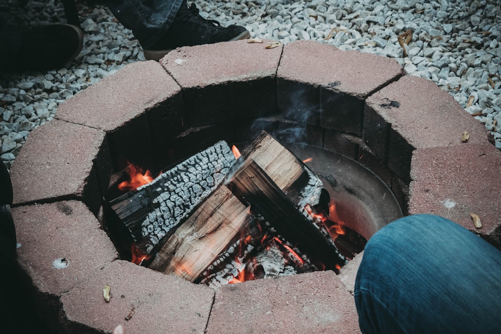 photo of burning wood logs in firepit