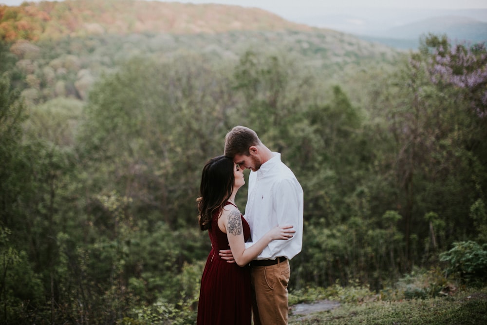 man and woman about to kiss during daytime