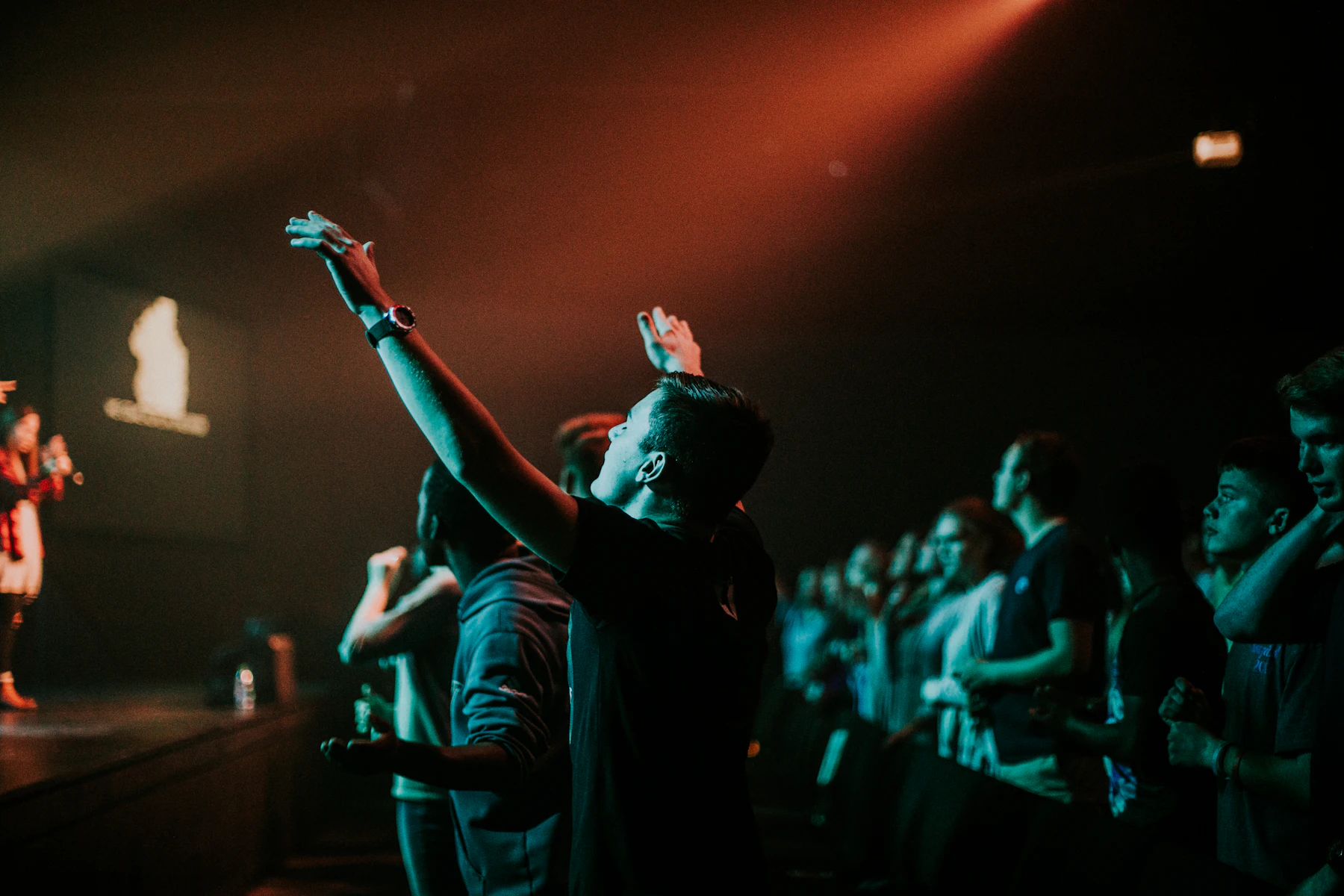 People gathered near the stage before a service