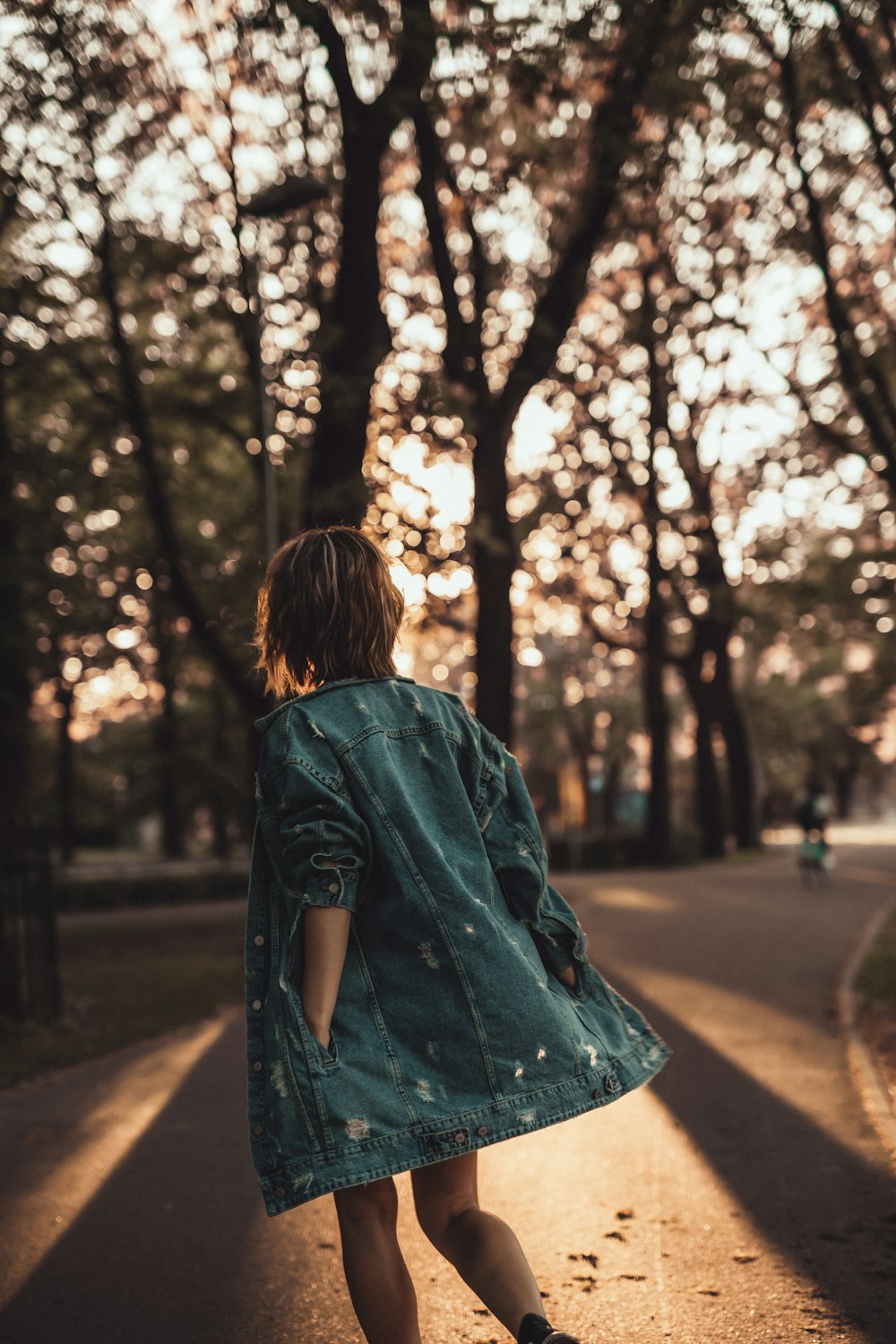 woman walking near trees