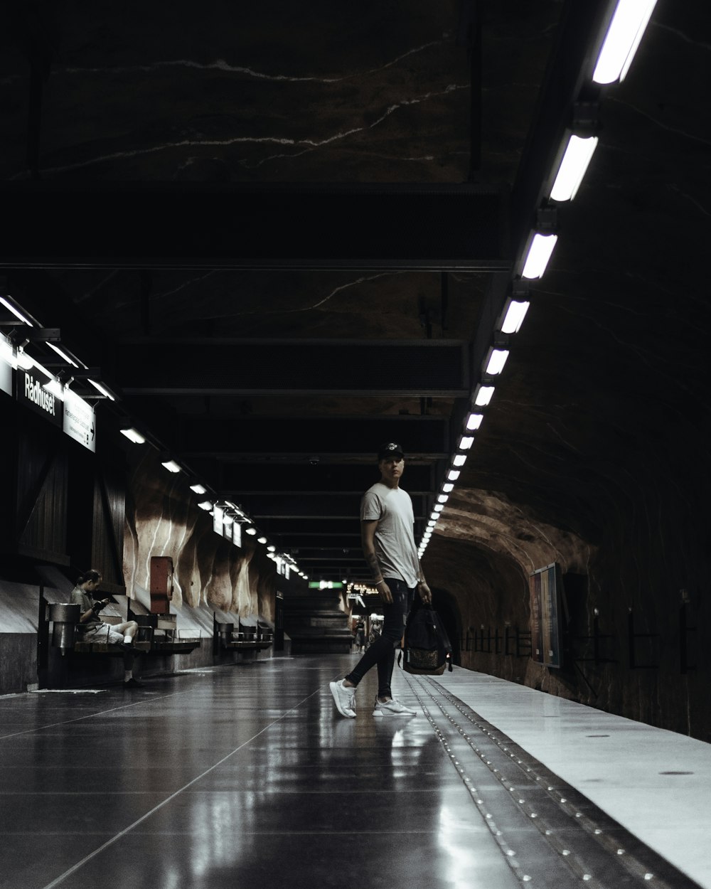 man standing on subway
