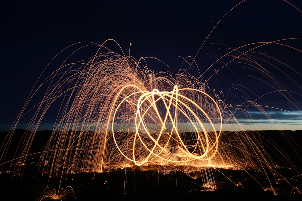 time-lapsed photography of a fire dancer