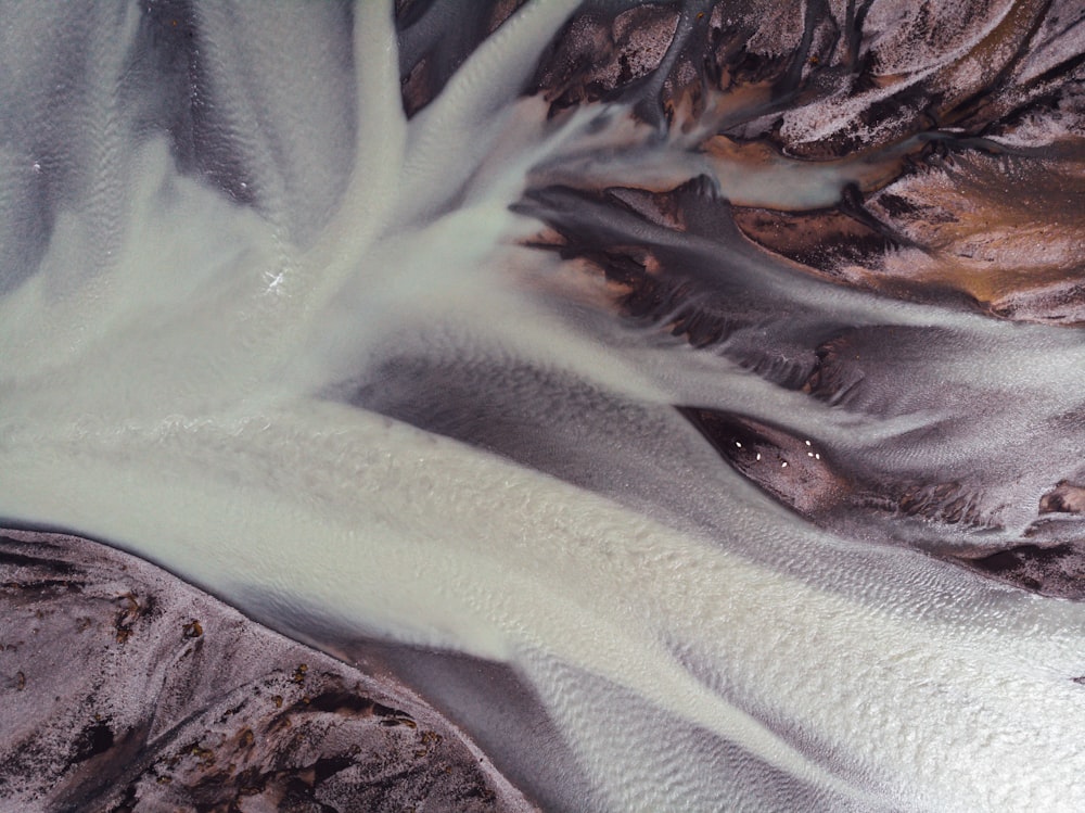 an aerial view of a snow covered mountain