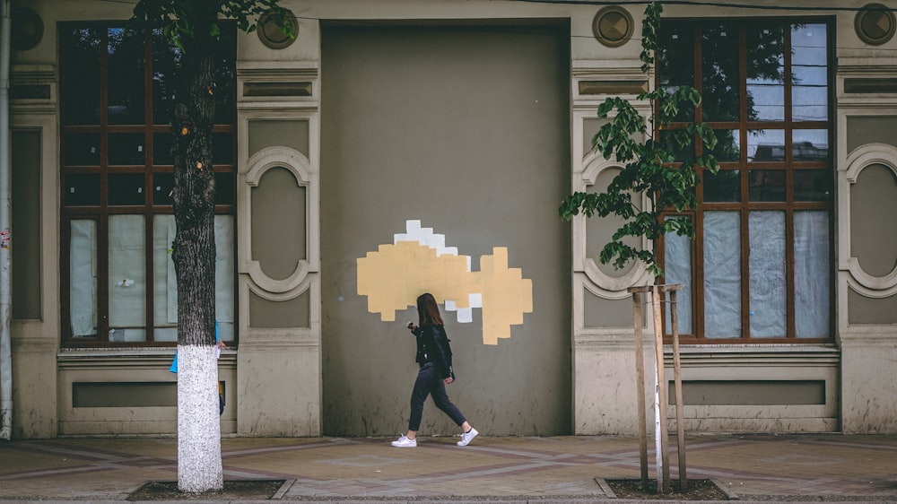 woman passing by on trees