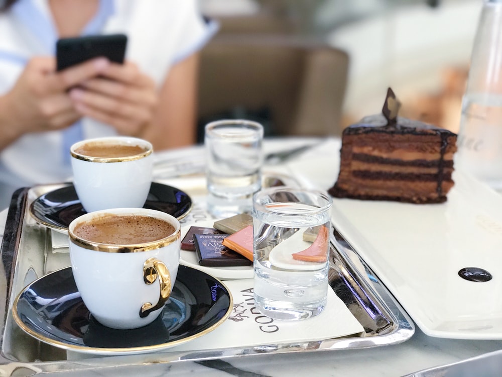 white ceramic cup on table