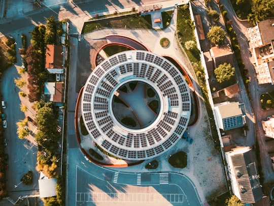 aerial photography of round concrete building in L'Aquila Italy