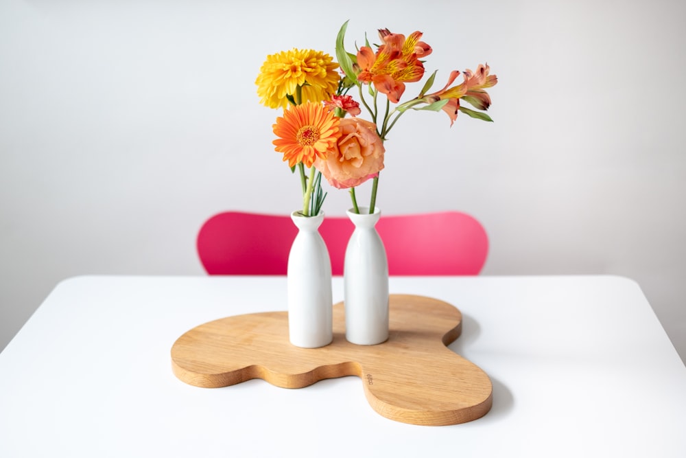 orange and yellow petaled flowers on table