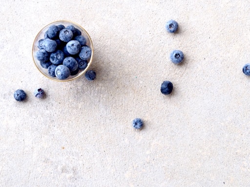 blueberries in clear glass bowl