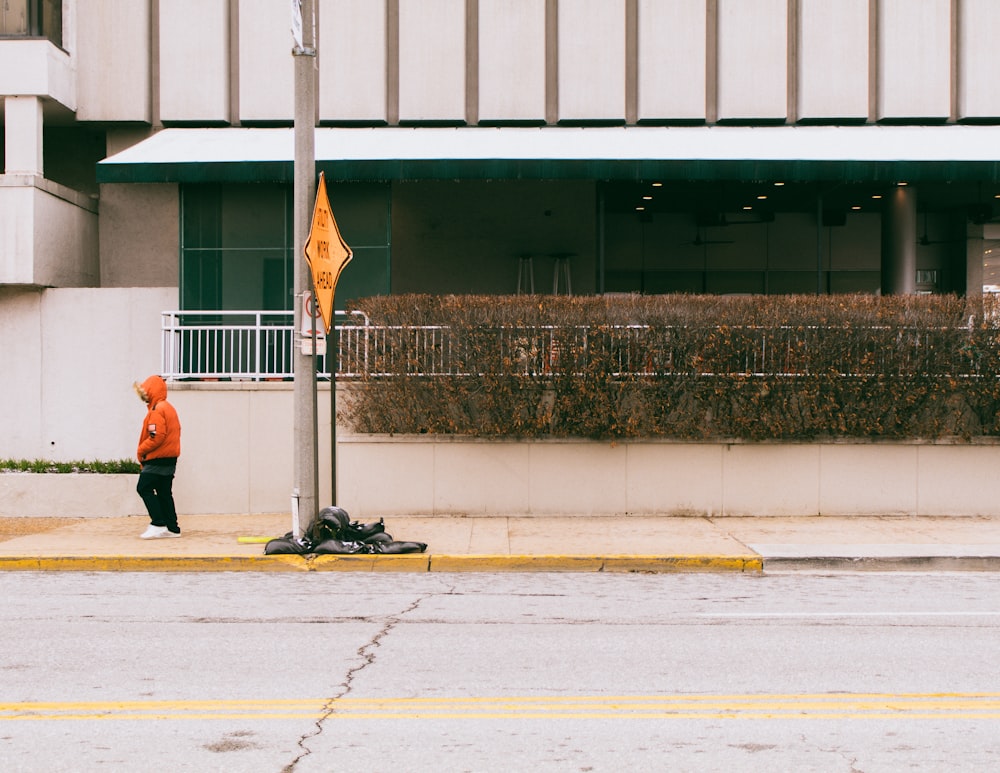 person standing on sidewalk