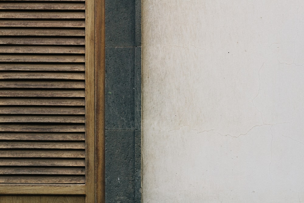 a cat sitting on a ledge next to a window