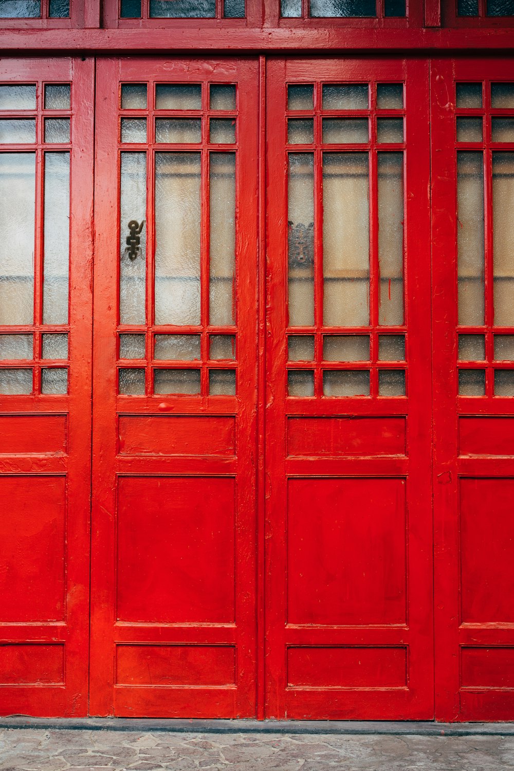 red wooden wall on concrete ground